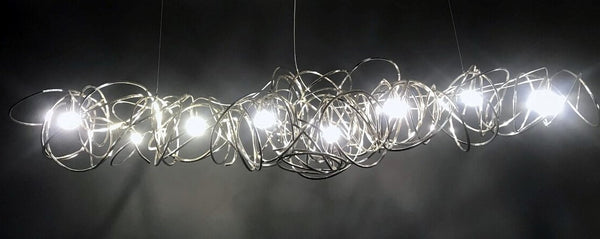 Ball of Yarn - Breathtaking art deco lighting. Bent aluminum framework in 4 color variants, equipped with multiple E17 light sources. This chandelier will make the most of your living room area, add style to a conference room or act as the perfect icebreaker for the reception. Each Ball of Yarn is handmade so allow for slight differences between the photos and your finished product.